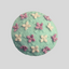 Mini daphne flowers on top of a mint green cupcake