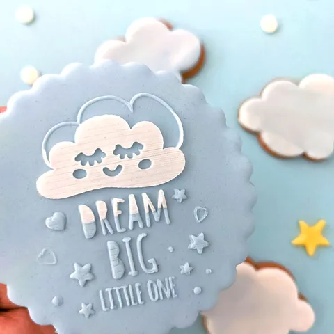 a blue cookie embossed with dream big little one