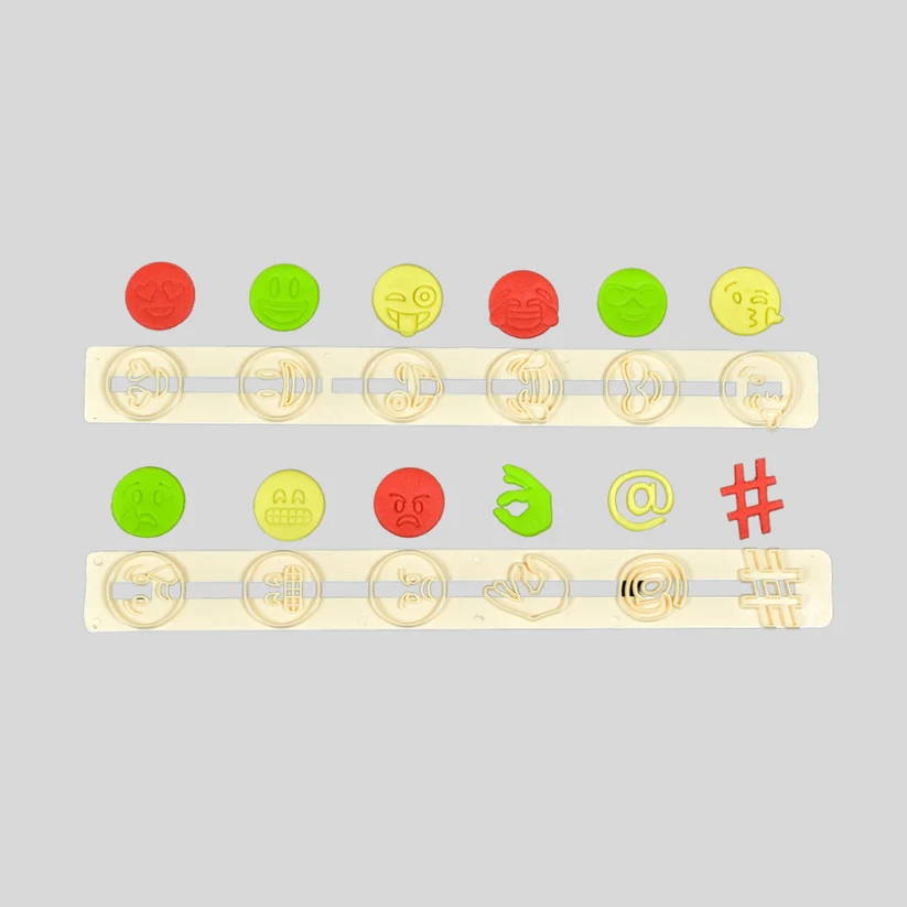 FMM expression fondant cutters, with examples of emojis cut from gumpaste icing