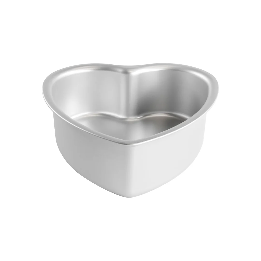 A heart-shaped aluminum cake pan with a smooth, reflective metallic surface, shown on a plain white background.