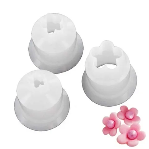 3 small blossom cutters alongside icing examples made using them
