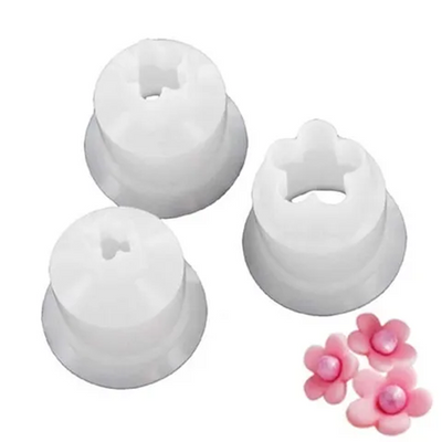 3 small blossom cutters alongside icing examples made using them