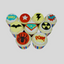 Nine cupcakes decorated with colorful comic book themed toppers, including a star, lightning bolt, explosion, bat symbol, superhero shield, radiation symbol, and spider, arranged on a light gray background.