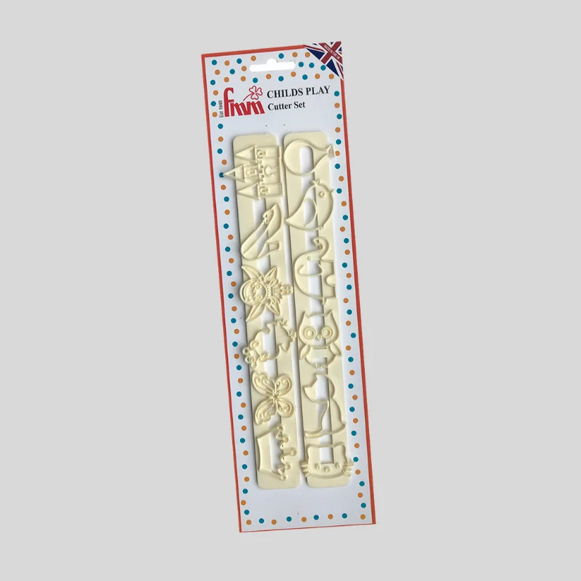 A boxed children'sset featuring pale cream-colored plastic fmm fondant cutters with shapes like a teapot, mug, cup, flower, and animal, presented on a white card with red and blue dotted borders. The package shows the brand name 'Fmm' at the top.