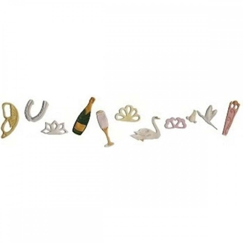 A row of small decorative gumpaste icing decorations shaped like horseshoe, crown, champagne bottle, flute, swan, rings, birds, and a pink object, arranged on a plain white background.