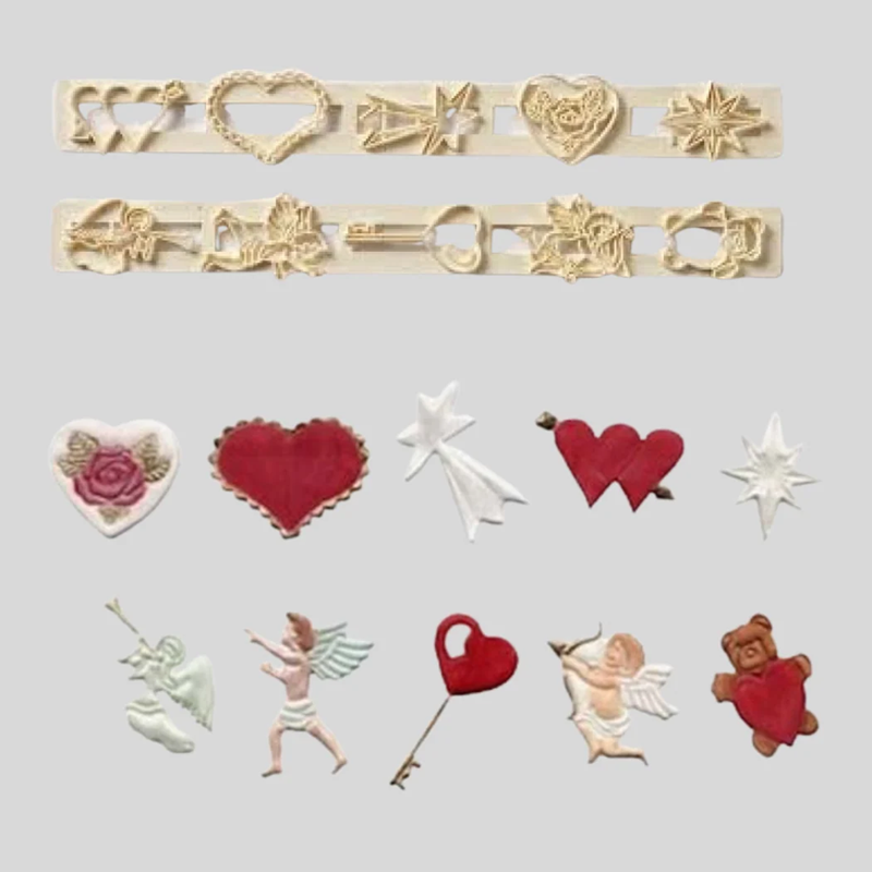 A set of Valentine's Day themed fondant cutters and icing examples arranged on a light gray background. The set includes various heart, star, key, and cupid designs in red, white, and beige tones.