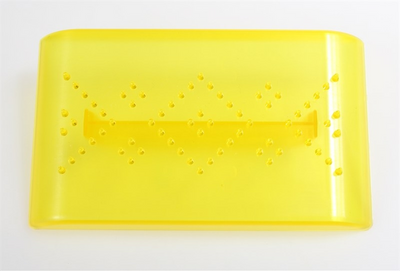 A bright yellow translucent plastic rectangular tray with a handle and small raised dot details, photographed on a plain white background.