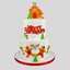 A two-tier white frosted Christmas cake decorated with orange gingerbread men, green trees, candy canes, and red 'Merry Christmas' lettering, topped with a gingerbread house and gingerbread man figure, on a light gray background.