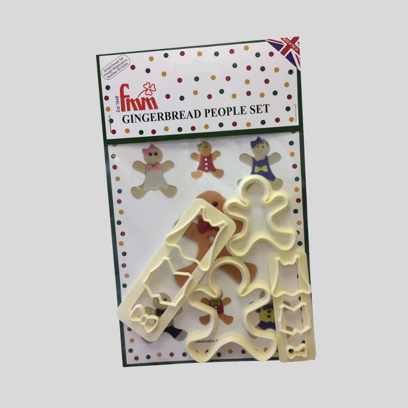 A FMM gingerbread people set in its original retail packaging, featuring cream-colored plastic cookie cutters on a white background.