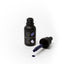 Black bottle of Sprinks gel color with open cap on a white background