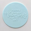 icing plaque made of teal fondant. Embossed with Happy Valentine's Day