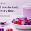 A promotional product shot for LORANN featuring a white bowl filled with translucent candies in red and purple, with a glass of matching purple liquid and a spoon on a light surface. Large text reads 'True-to-taste, every time.