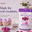 LORANN Hard Candy Mix in a purple and white resealable bag, displayed next to decorated cupcakes, a bowl of colorful hard candies, and loose candy pieces on a light studio background with blurred decorative elements.