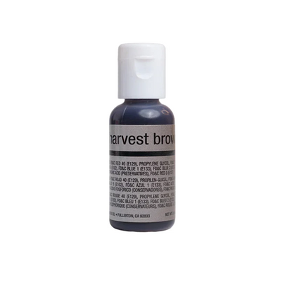 A small bottle of airbrush food coloring with a white cap and a dark label reading 'harvest brown' on a plain white background.
