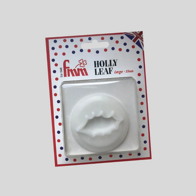 A white plastic Holly Leaf  cutter in its original retail packaging, featuring a red, white, and blue polka dot border with the brand name 'Fmm' and 'HOLLY LEAF Large - 55mm' printed on the card.