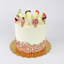 a cake decorated with ice cream cones and popsicles made of fondant icing