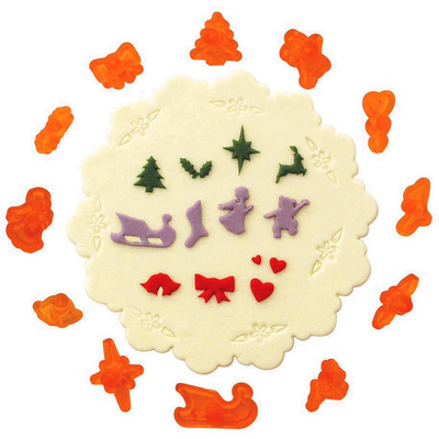 A set of 12 miniature Christmas and wedding themed icing cutters, with various shapes including a Christmas tree, reindeer, angel, and other festive elements.