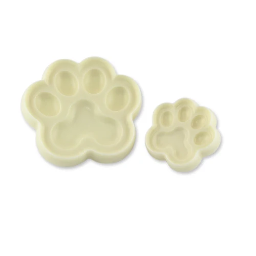 Two paw-shaped cutters made for decorating cakes and pastries, representing dog or cat paws.