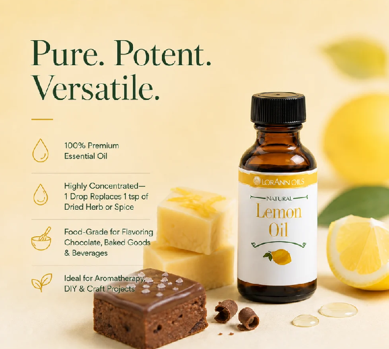 A bottle of Lorann Oils Natural Lemon Oil displayed next to lemon slices, a chocolate bar, and a bar of soap on a warm cream background with marketing text.