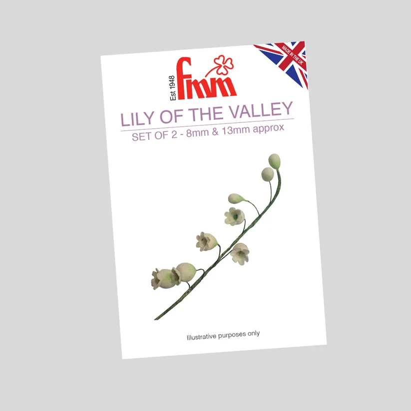  'Lily of the Valley' by Fmm, shown at a slight angle on a solid gray background. The white packet features the red and purple Fmm logo, a small Union Jack flag, and an illustration of a lily of the valley stem with pale green flowers.