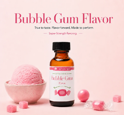 An amber glass bottle of Lorann Oils Bubble Gum Flavor  centered on a soft pink background, with large pink text above. A pink ice cream scoop in a small bowl, loose pink gum pieces, and wrapped pink gum candies are arranged around the bottle.