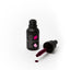 Black bottle of Sprinks gel color with a dropper on a white background