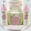 A three-tiered white and pink castle-shaped birthday cake decorated with gold rose details, pink towers, and the words 'ONCE UPON A TIME' and 'HAPPY EVER AFTER' on a white background.