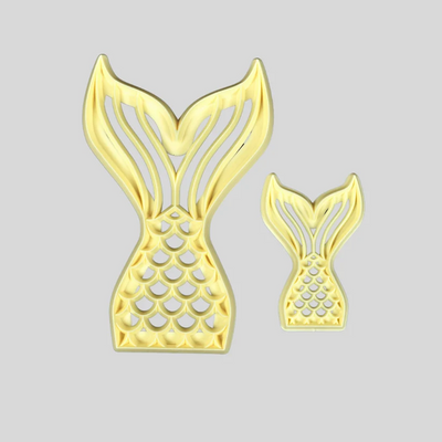 Two gold mermaid tail-shaped icing cutters, one large and one small, displayed on a solid light gray background.