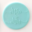A round turquoise blue fondant plaque with the words 'Miss to Mrs' in raised script, shown against a plain light background.