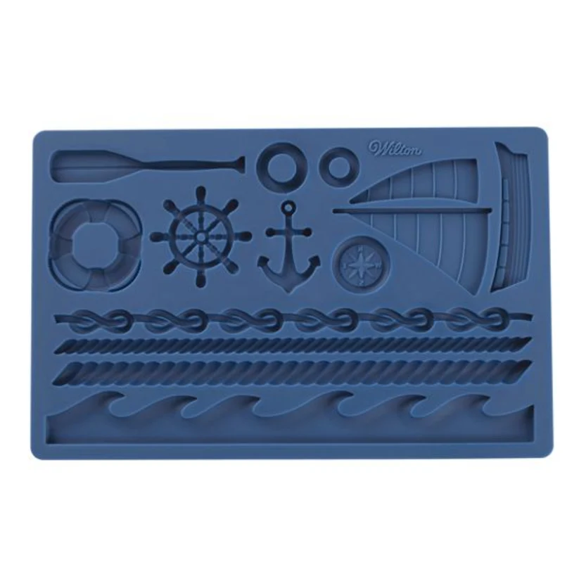 A blue rectangular silicone mold with nautical-themed cavities, including a ship's wheel, anchor, sailboat, rope, waves, and life preserver, on a plain white background.