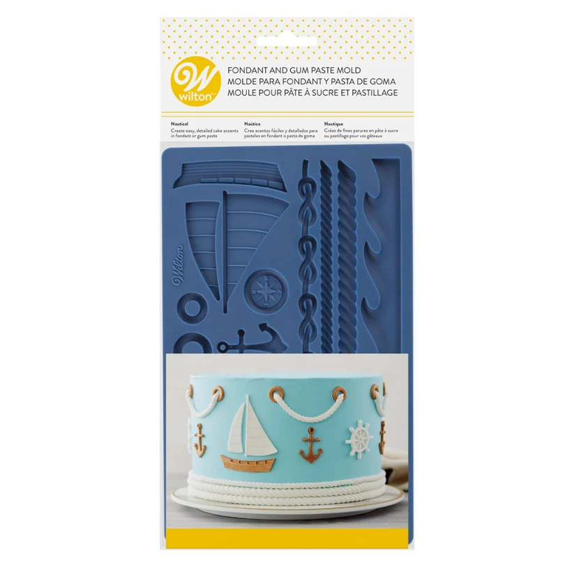 Wilton fondant and gum paste mold in a blue nautical theme, shown in its retail packaging with a sample of a decorated cake featuring the mold's designs.