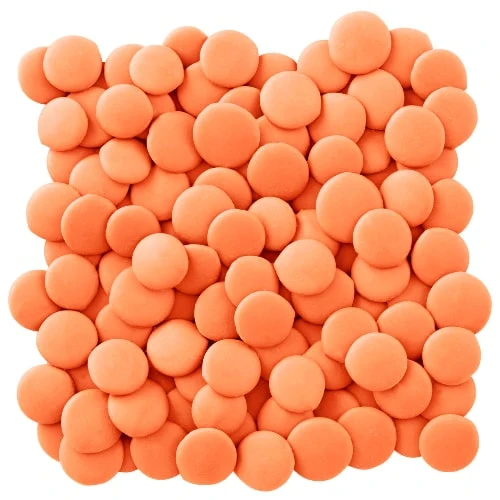 a pile of orange candy melt buttons
