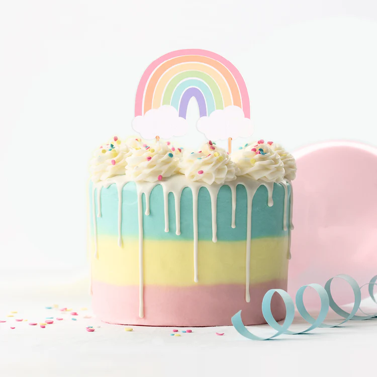 Colorful cake with a rainbow design on top against a white background