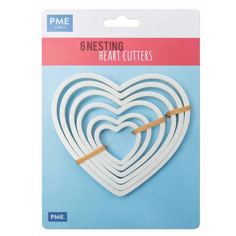 PME Cake 6 Nesting Heart Cutters in their retail packaging, featuring white  heart-shaped cutters held together on a blue and pink card.