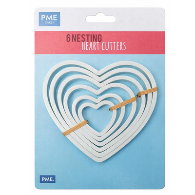 PME Cake 6 Nesting Heart Cutters in their retail packaging, featuring white  heart-shaped cutters held together on a blue and pink card.