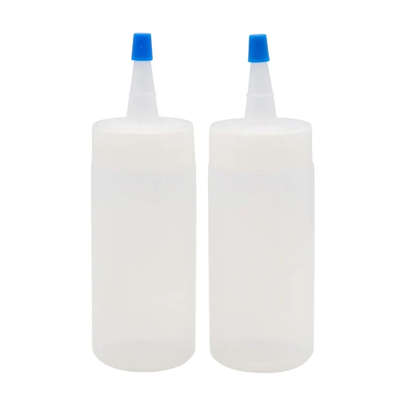 Two translucent white squeeze bottles with blue nozzles, shown side by side on a plain white background.