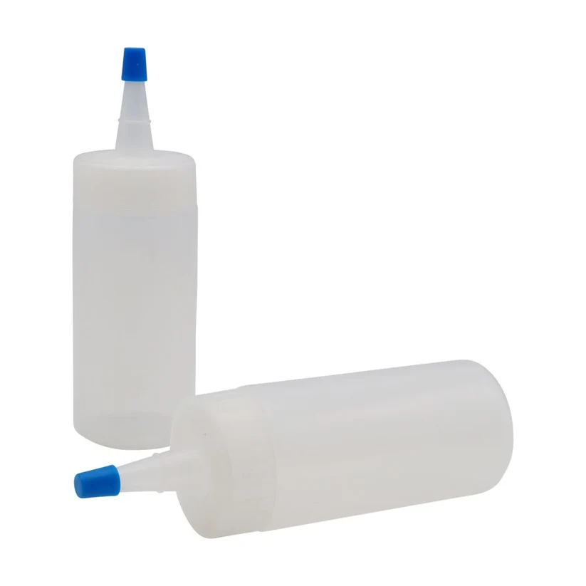 Two white bottles with blue caps on a white background