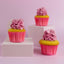 Vnilla cupcakes in pink baking cups with pink icing swirls