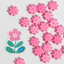 Pink flower-shaped cupcake candies with a PME logo on a white background