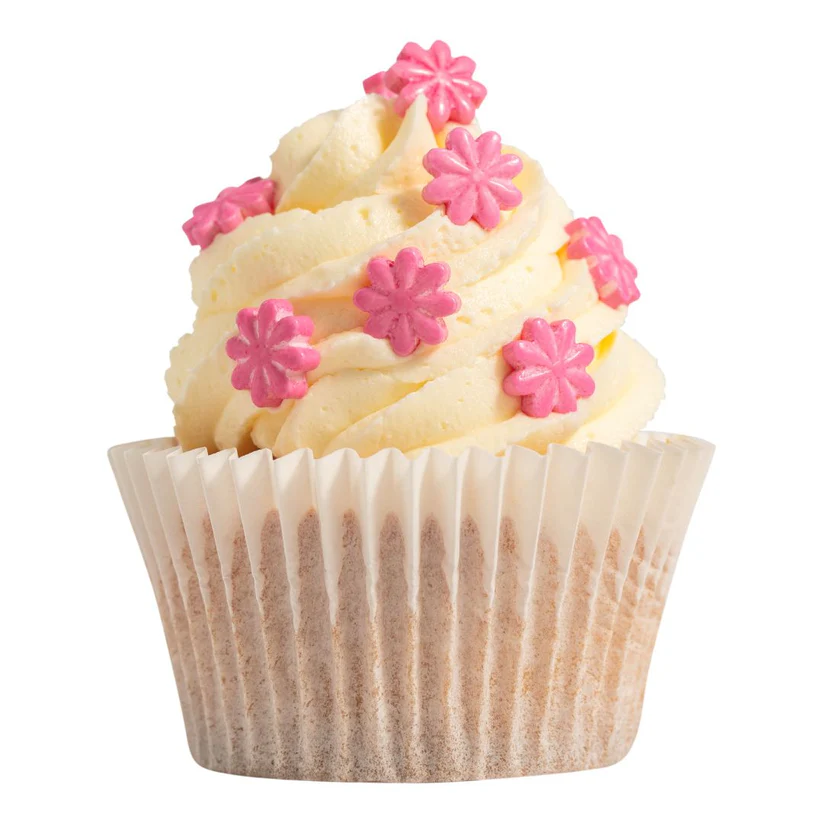 Cupcake with white frosting and pink flower decorations on a white background