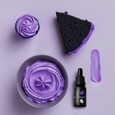 Purple cake, cupcake, and frosting on a purple background with a bottle labeled 'COLOUR'.