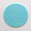 A round light blue decorative fondant piece with a raised diamond lattice pattern and small diamond motifs, shown on a plain off-white background.