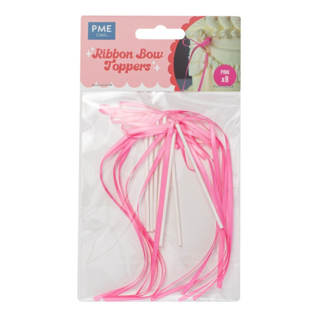Packaged pink ribbon bow toppers with PME logo on a white background