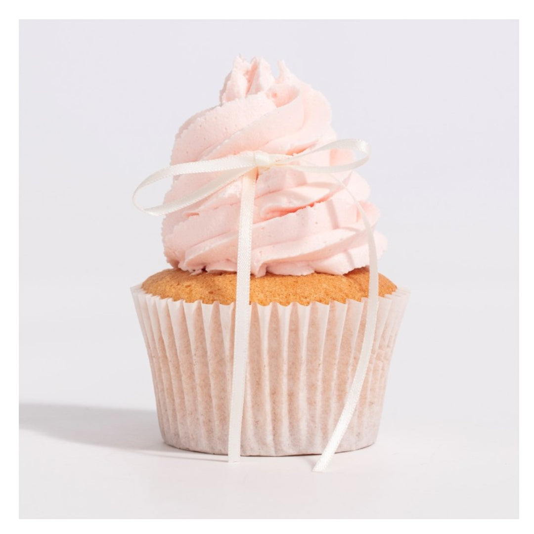 Cupcake with pink frosting and a white ribbon on a light gray background