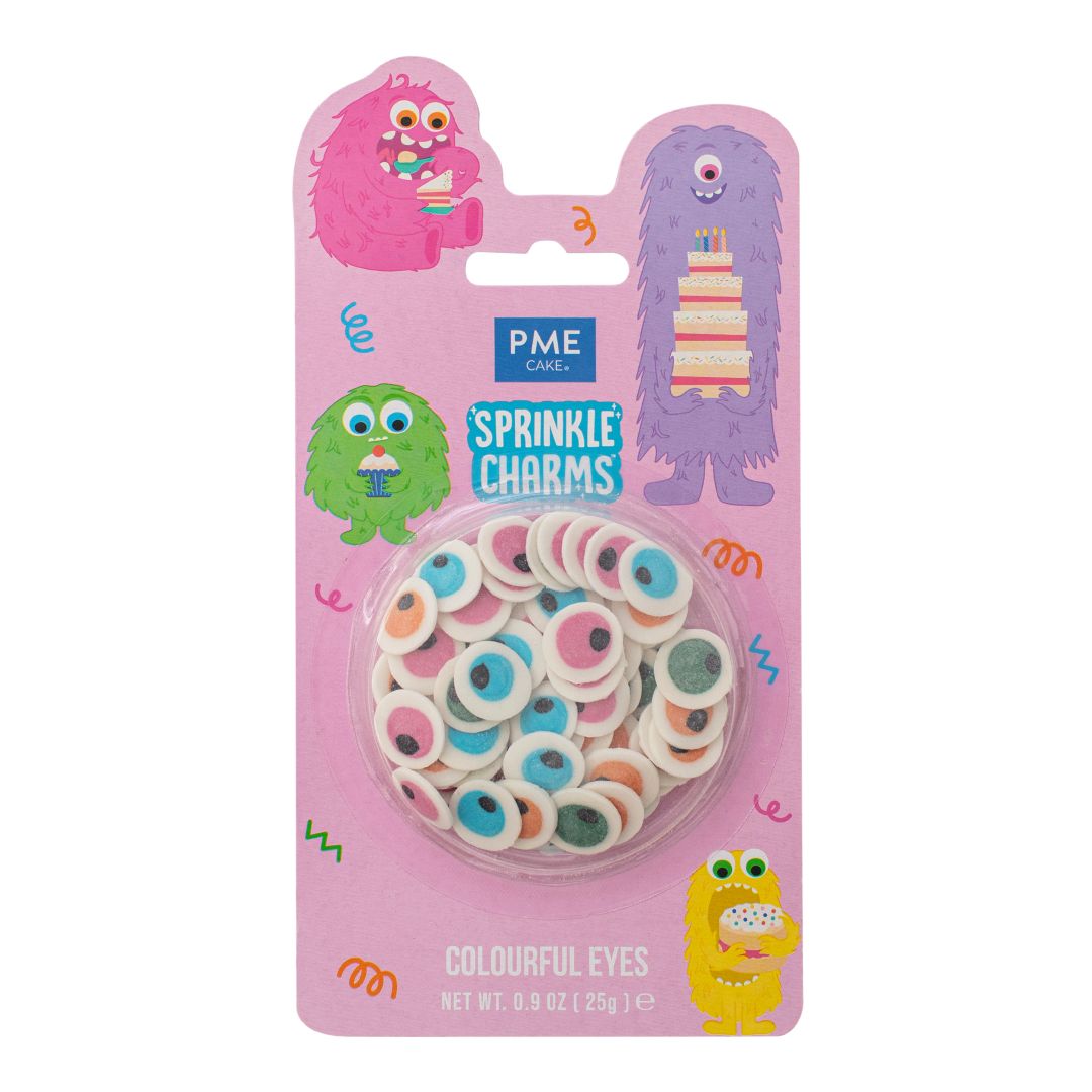 Packaging of PME Cake Sprinkle Charms with colorful eyes on a pink background