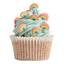Cupcake with green frosting and rainbow decorations on a white background