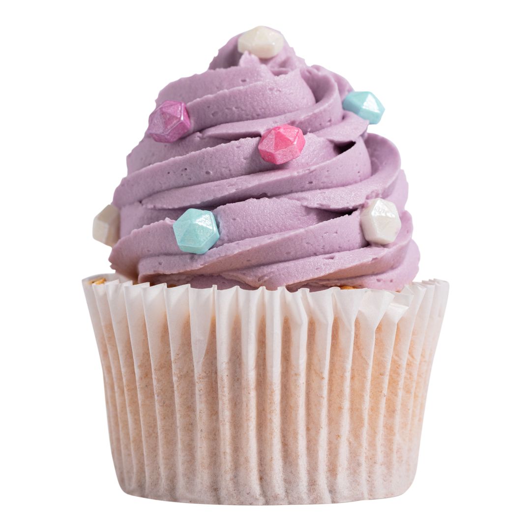 Cupcake with purple frosting and decorative gems on a white background