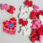 Decorative candies with red and pink bows and hearts on a white background, featuring a PME brand.