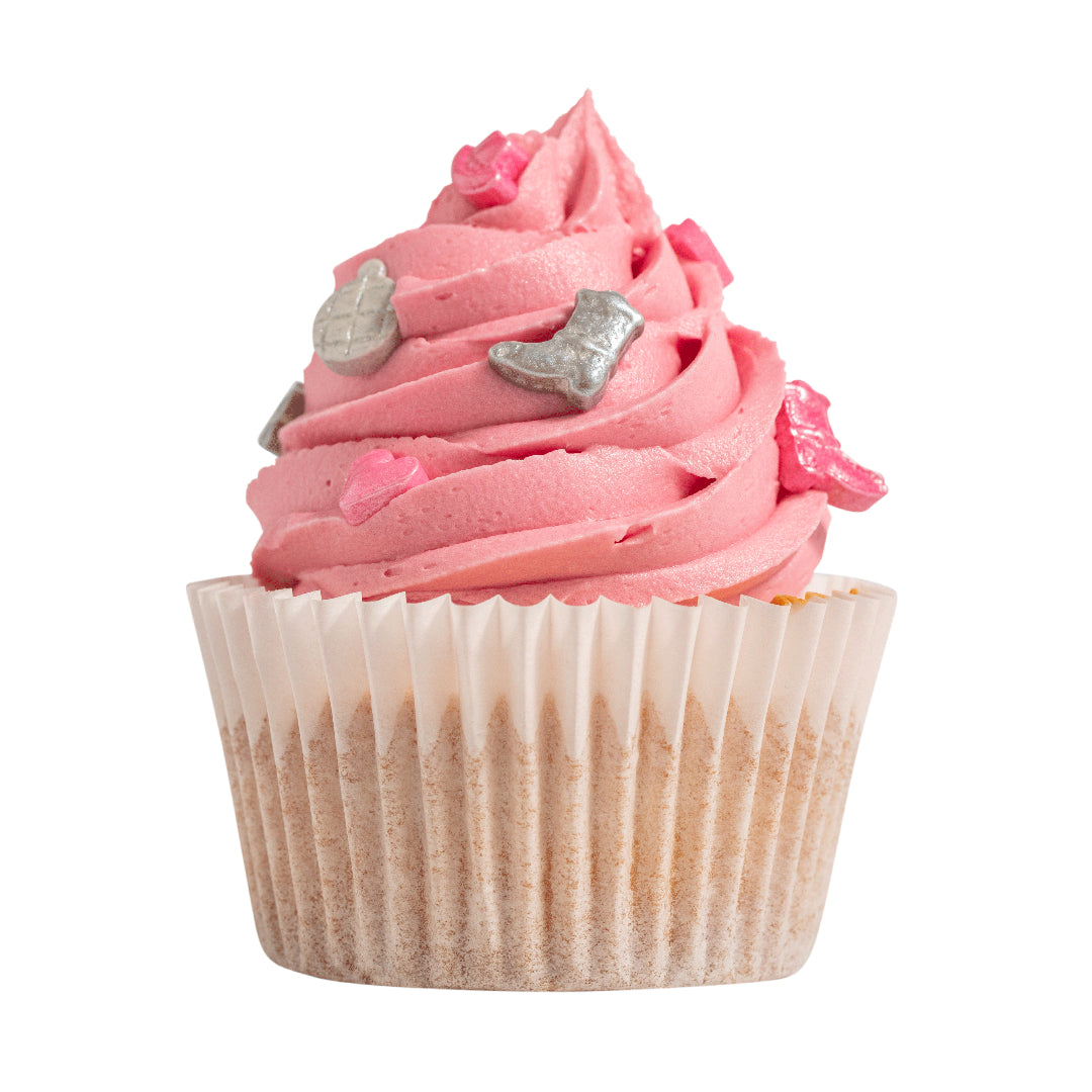 Cupcake with pink frosting and silver boot decorations on a white background