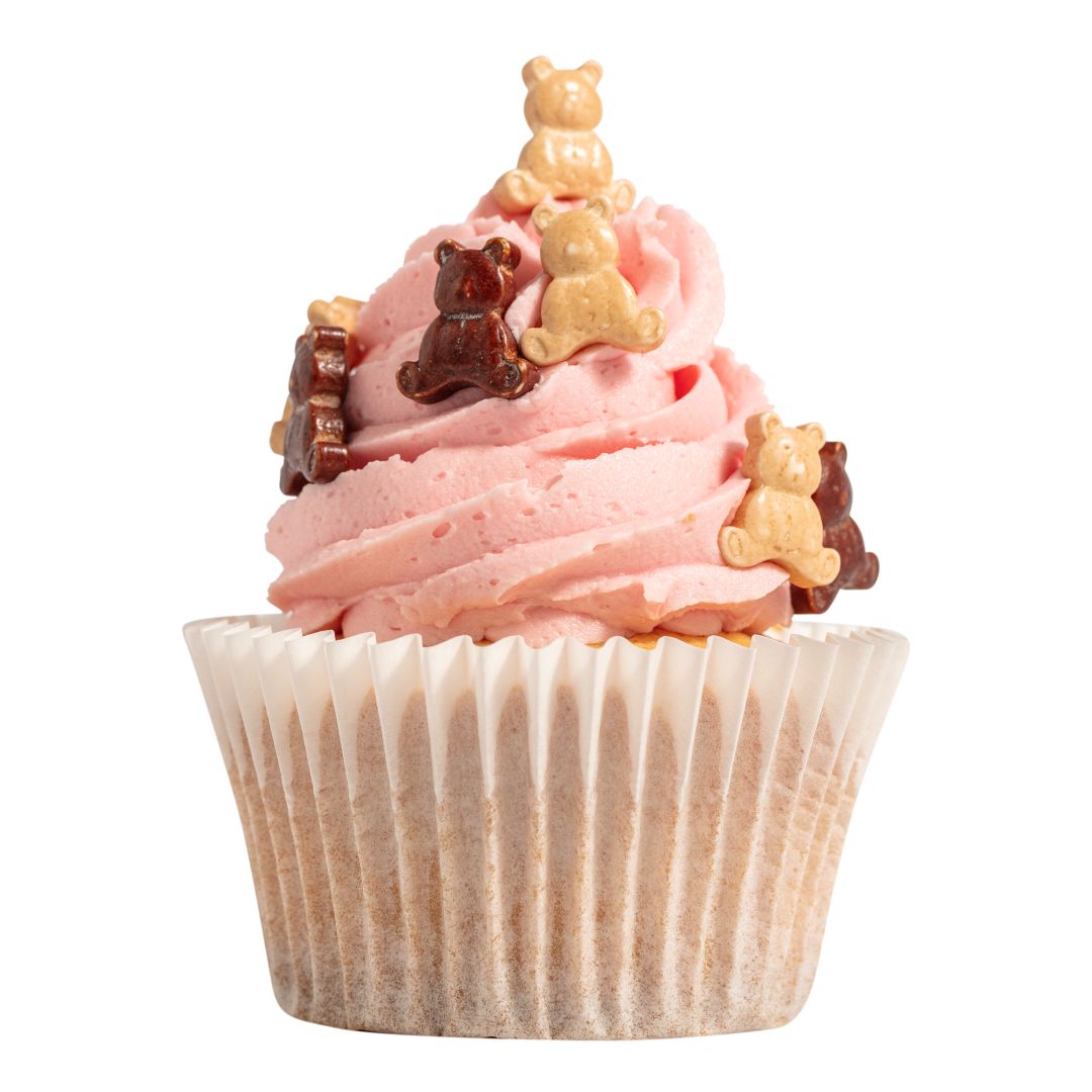 Cupcake with pink frosting and bear-shaped sprinkles on a white background